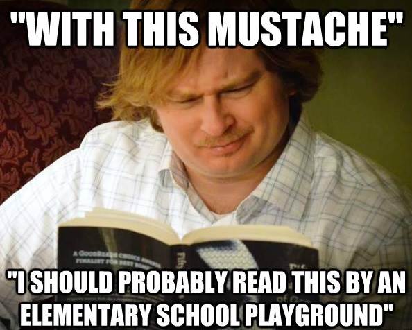 Curious Male Reads Fifty Shades With A Mustache