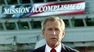 George Bush in front of the mission accomplished banner