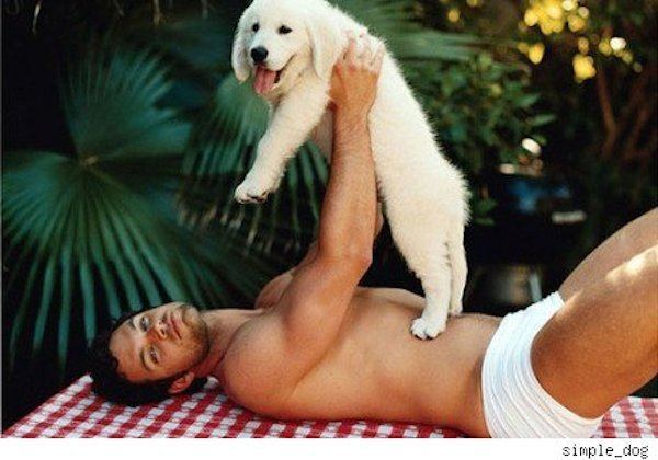 Shirtless Guy With A Yellow Lab Puppy