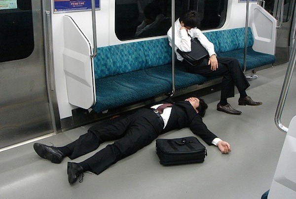 Two Men Sleeping On Tokyo Subway