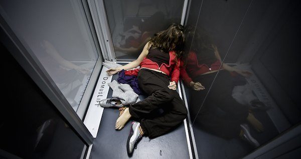 Women Laying In Elevator