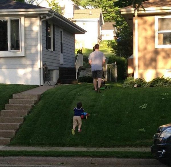 Father Son Mowing Yard