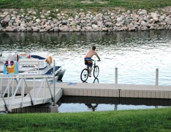 Biking Over Water Photograph