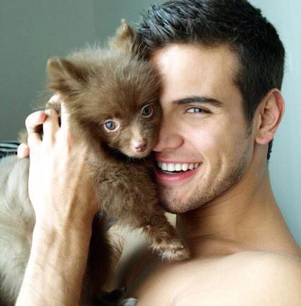 Cute Guy With A Fluffy Puppy