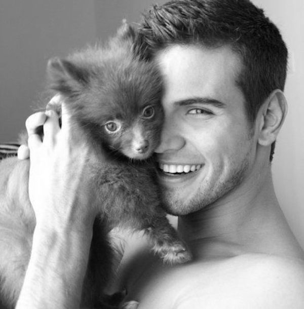 Cute Guy With Fluffy Puppy