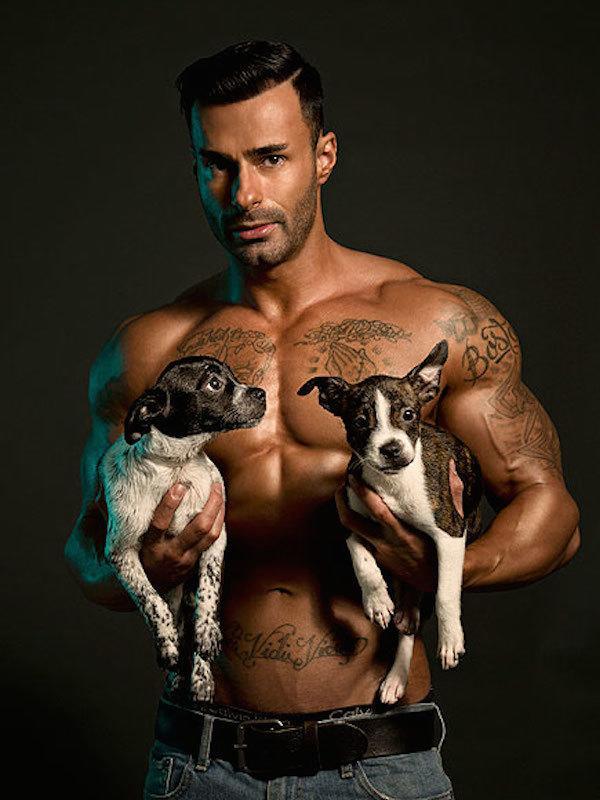 Shirtless Guy With Two Puppies